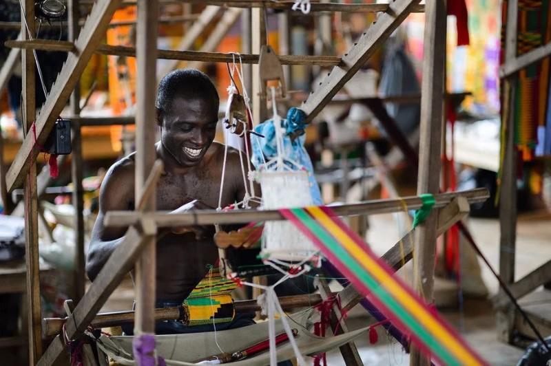 Ghanaian Artisan working on a Weaver